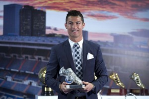 MADRID, SPAIN - OCTOBER 02: Cristiano Ronaldo poses for a picture with his trophy as all-time top scorer of of Real Madrid CF at Honour box-seat of Santiago Bernabeu Stadium on October 2, 2015 in Madrid, Spain. Portuguese palyer Cristiano Ronaldo overtook on his last UEFA Champions League match against Malmo FF Raul,s record as Real Madrid all-time top scorer. (Photo by Gonzalo Arroyo Moreno/Getty Images)